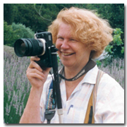 Photo of Marsha J Black in the field with her camera