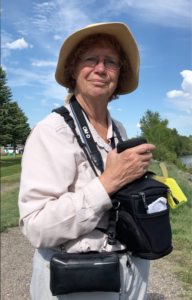 Marsha Black taking photographs while walking along the Yellowstone River in Montana